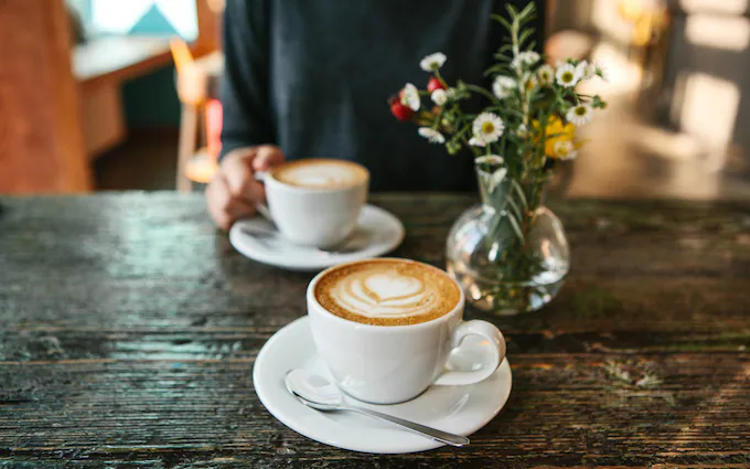 A catch up over coffee is a good way to connect with loved ones, which is a great wellness habit